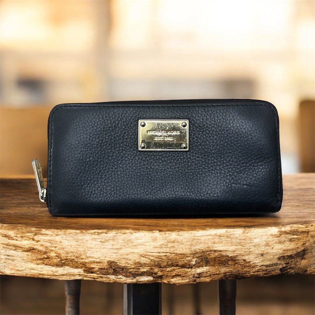 Michael Kors Jet Set Continental Zip-Around Wallet (Category: Wallets & Card holders) located in Santa Rosa. Submitted by yen.ph (Listing ID 1409837999, Image 1). Description: Product Information * Brand: MICHAEL Michael Kors * Style: Jet Set Continental Wallet, zip-around closure * Material: Pebbled or grained leather with a polyester or linen lining * Hardware: Gold-tone finish * Color: Black Features This style of wallet is designed for ample 