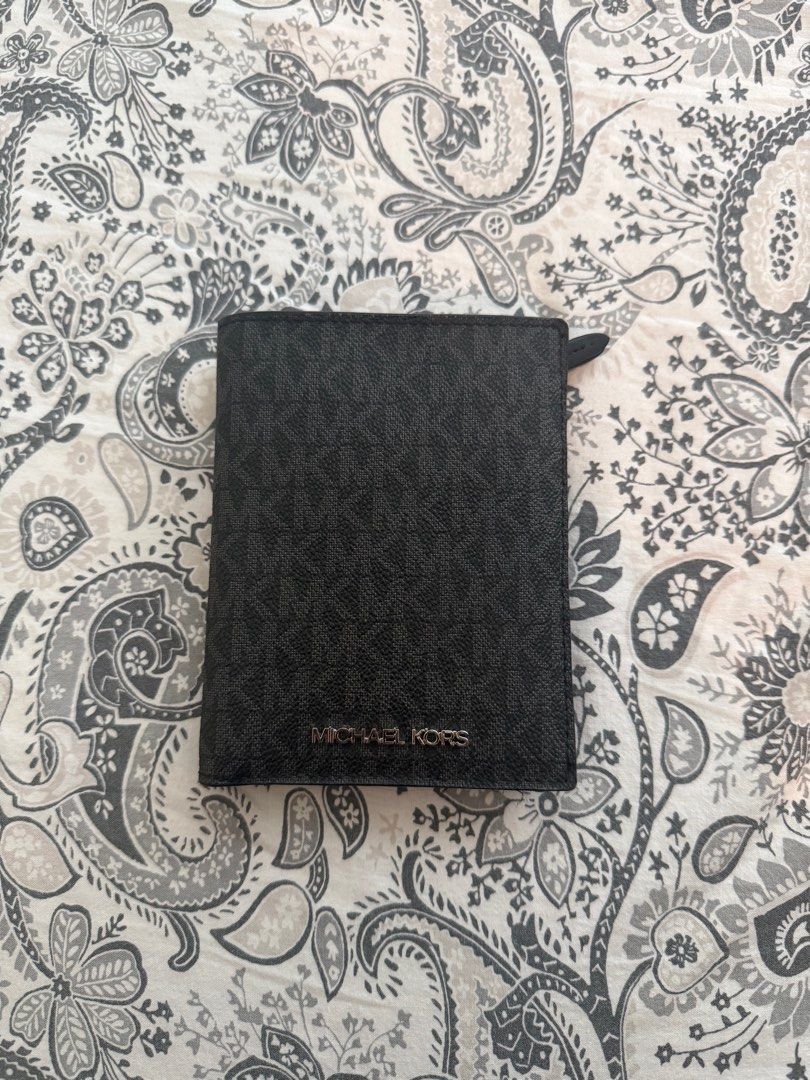 Michael Korss Passport Wallet (Category: Wallets & Card holders) located in Baliuag. Submitted by jaredcarousel (Listing ID 1409809621, Image 1). Description: - Authentic Michael Kors wallet - Black monogram pattern - Multiple card slots - Clear ID window - Zippered compartment - Compact size - Made of leather - Michael Kors logo on front 1999 (Shipped).