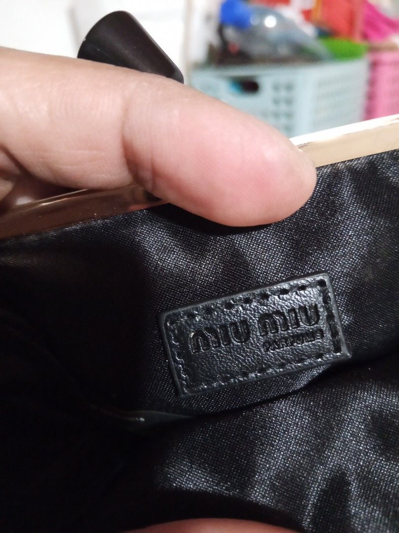 Miu Miu Coin Purse (Category: Luxury Bags & Wallets) located in Zamboanga. Submitted by alminajammang19 (Listing ID 1409932191, Image 3). Description: - Authentic Miu Miu coin purse - Luxurious red velvet exterior - Sleek black interior - Elegant gold-toned clasp with black accents - Features the iconic Miu Miu logo - Includes original product tag - Made in China.
