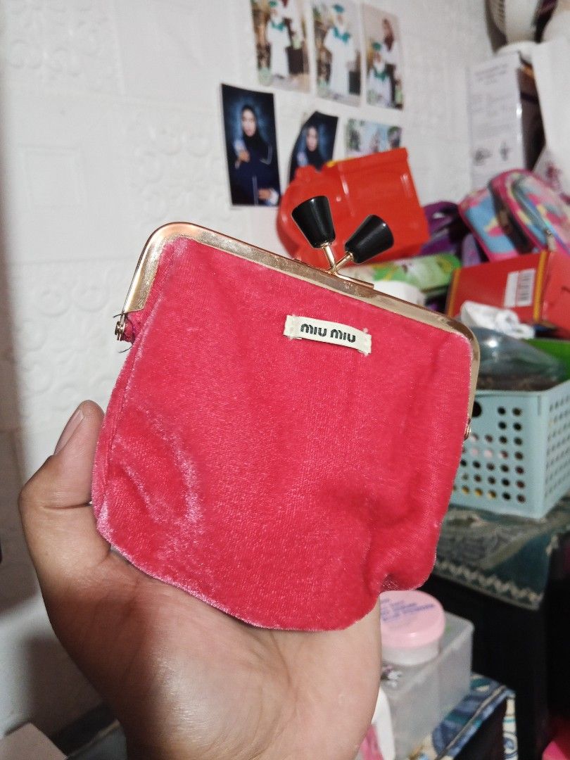 Miu Miu Coin Purse (Category: Luxury Bags & Wallets) located in Zamboanga. Submitted by alminajammang19 (Listing ID 1409932191, Image 1). Description: - Authentic Miu Miu coin purse - Luxurious red velvet exterior - Sleek black interior - Elegant gold-toned clasp with black accents - Features the iconic Miu Miu logo - Includes original product tag - Made in China.