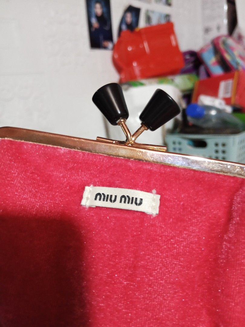 Miu Miu Coin Purse (Category: Luxury Bags & Wallets) located in Zamboanga. Submitted by alminajammang19 (Listing ID 1409932191, Image 2). Description: - Authentic Miu Miu coin purse - Luxurious red velvet exterior - Sleek black interior - Elegant gold-toned clasp with black accents - Features the iconic Miu Miu logo - Includes original product tag - Made in China.