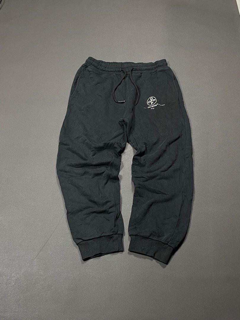 Off-White 2019 Black Sweatpants (Category: Joggers) located in Marikina City. Submitted by stolenph (Listing ID 1409957946, Image 1). Description: Black Off-White sweatpants with a drawstring waist. Features the Off-White logo and "2019" print on the front. The left leg has a pink and white diagonal stripe design with the number "66". Includes the Off-White "Main Label" tag. The sweatpants have a relaxed fit. - No Issue - XLarge - 28 to 34 Waistl