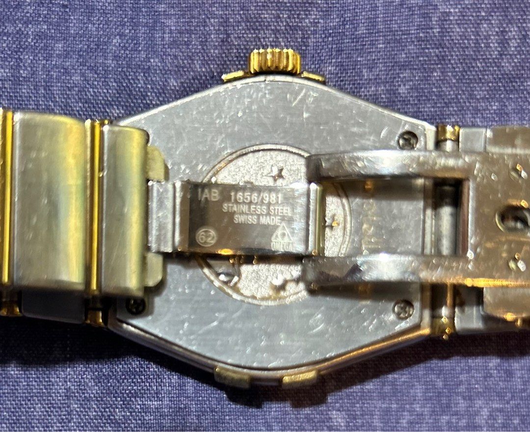 Omega Constellation Gold Watch (Category: Luxury Watches) located in Pasig City. Submitted by timecheckmanila (Listing ID 1409958605, Image 3). Description: This luxury vintage watch is a timeless and rare piece from the 1996 international collection, made with water resistance of up to 50 meters. With an elegant stainless steel press-in case enhanced by a gold bezel, an integrated steel and gold watch strap, and quartz electronic analogue moveme