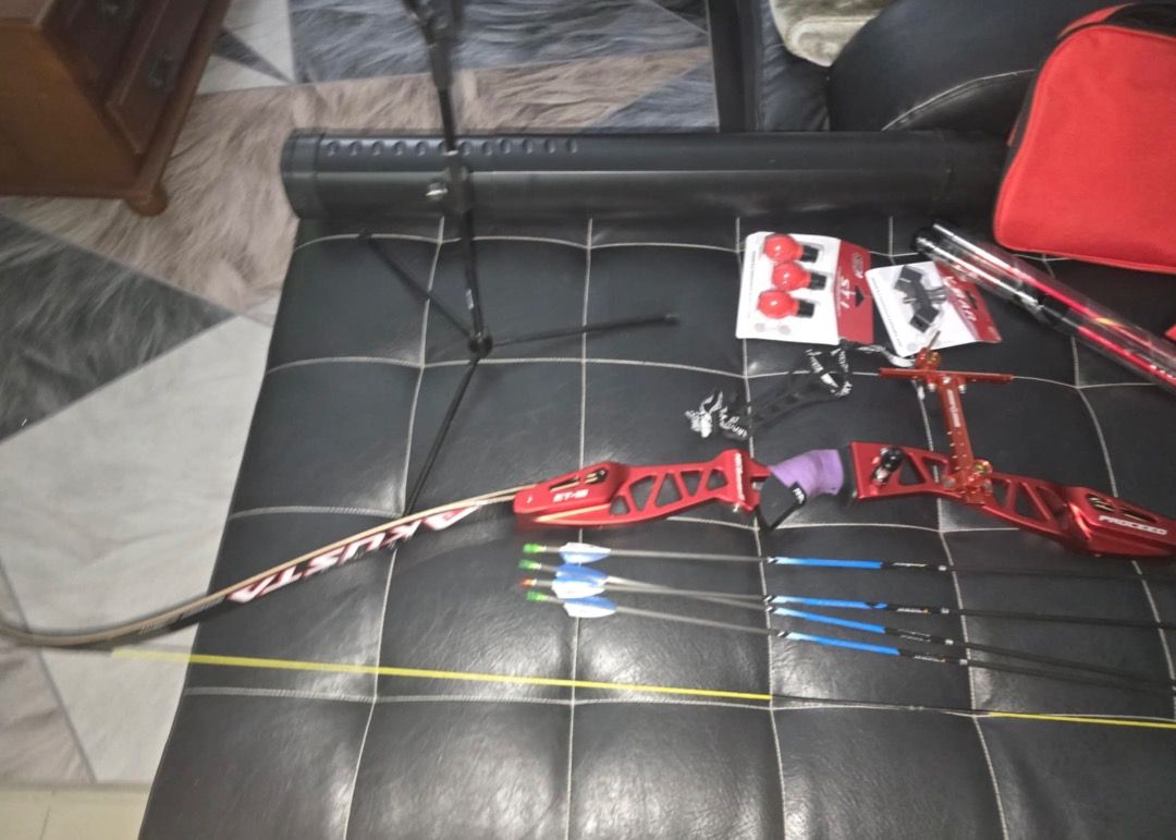 Recurve Bow Archery Set(for left handed) (Category: Other Sports Equipment and Supplies) located in Tarlac. Submitted by alleiz1521 (Listing ID 1409909433, Image 2). Description: Complete archery set including a red akusta recurve bow, arrows, stabilizer, sight, arrow case, bag and accessories. Comes with a red carrying bag and a bow case. Includes additional items such as arrow rests and other small parts. Ready for use. Reason for selling :Owne
