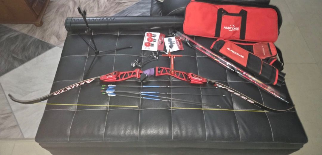 Recurve Bow Archery Set(for left handed) (Category: Other Sports Equipment and Supplies) located in Tarlac. Submitted by alleiz1521 (Listing ID 1409909433, Image 3). Description: Complete archery set including a red akusta recurve bow, arrows, stabilizer, sight, arrow case, bag and accessories. Comes with a red carrying bag and a bow case. Includes additional items such as arrow rests and other small parts. Ready for use. Reason for selling :Owne