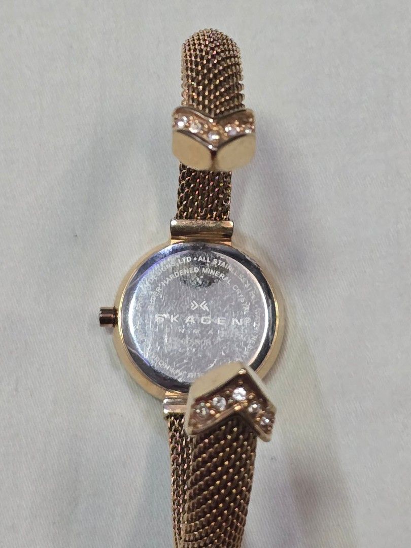 Skagen Denmark Gold Watch with Mesh Strap (Category: Women's Watches) located in Puerto Princesa. Submitted by eunizzie (Listing ID 1409982172, Image 2). Description: - Skagen Denmark watch - Gold-toned mesh strap - Round face with mother-of-pearl effect - Adorned with small crystals - Steel back - Decorative crystals on strap - Stylish accessory.