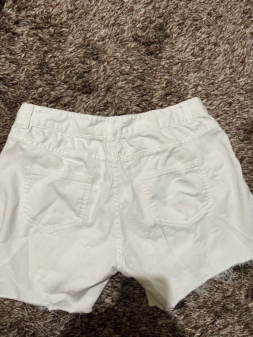 Acne Studios White Denim Shorts (Category: Shorts) located in Manila. Submitted by prelovedbymissp (Listing ID 1410109614, Image 3). Description: - Acne Studios white denim shorts - Button and zipper closure - Classic five-pocket design - Raw hem - Regular fit - Acne Studios logo on waistband.