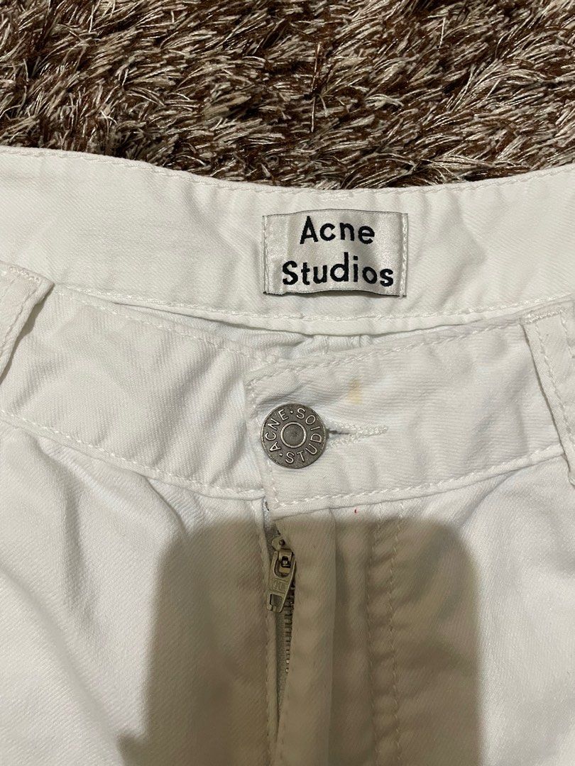 Acne Studios White Denim Shorts (Category: Shorts) located in Manila. Submitted by prelovedbymissp (Listing ID 1410109614, Image 2). Description: - Acne Studios white denim shorts - Button and zipper closure - Classic five-pocket design - Raw hem - Regular fit - Acne Studios logo on waistband.