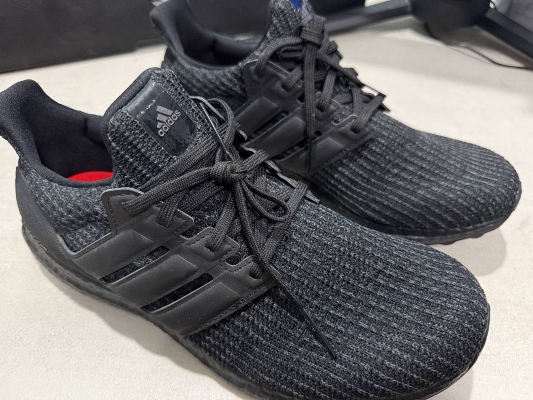 Adidas Ultraboost 4.0 DNA Triple Black (Category: Sneakers) located in Manila. Submitted by pael92 (Listing ID 1410175901, Image 1). Description: - Adidas Ultraboost sneakers - Color: Black - Features the iconic three stripes - Ultraboost branding on the heel - Black laces and sole - Knit upper material - Modern and versatile design USED ONLY ONCE MINT CONDITION.
