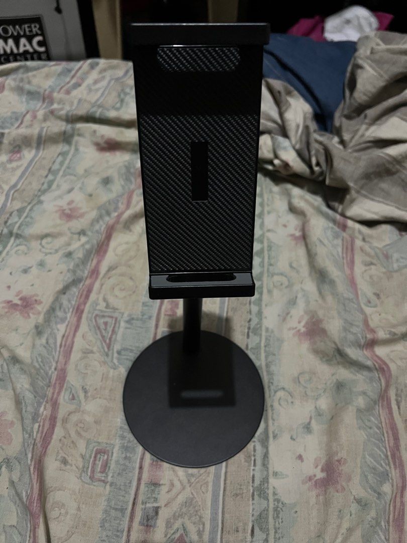 Adjustable tablet Stand (Category: Mounts & Holders) located in Paranaque City. Submitted by noblehawk.94ceb8 (Listing ID 1410171832, Image 1). Description: - Adjustable phone stand - Carbon fiber-like textured back - Circular base - Sturdy metal construction - Height adjustable - Suitable for phones and small tablets - Black color Firm price MOP: Maya, GCash Location: Parañaque.
