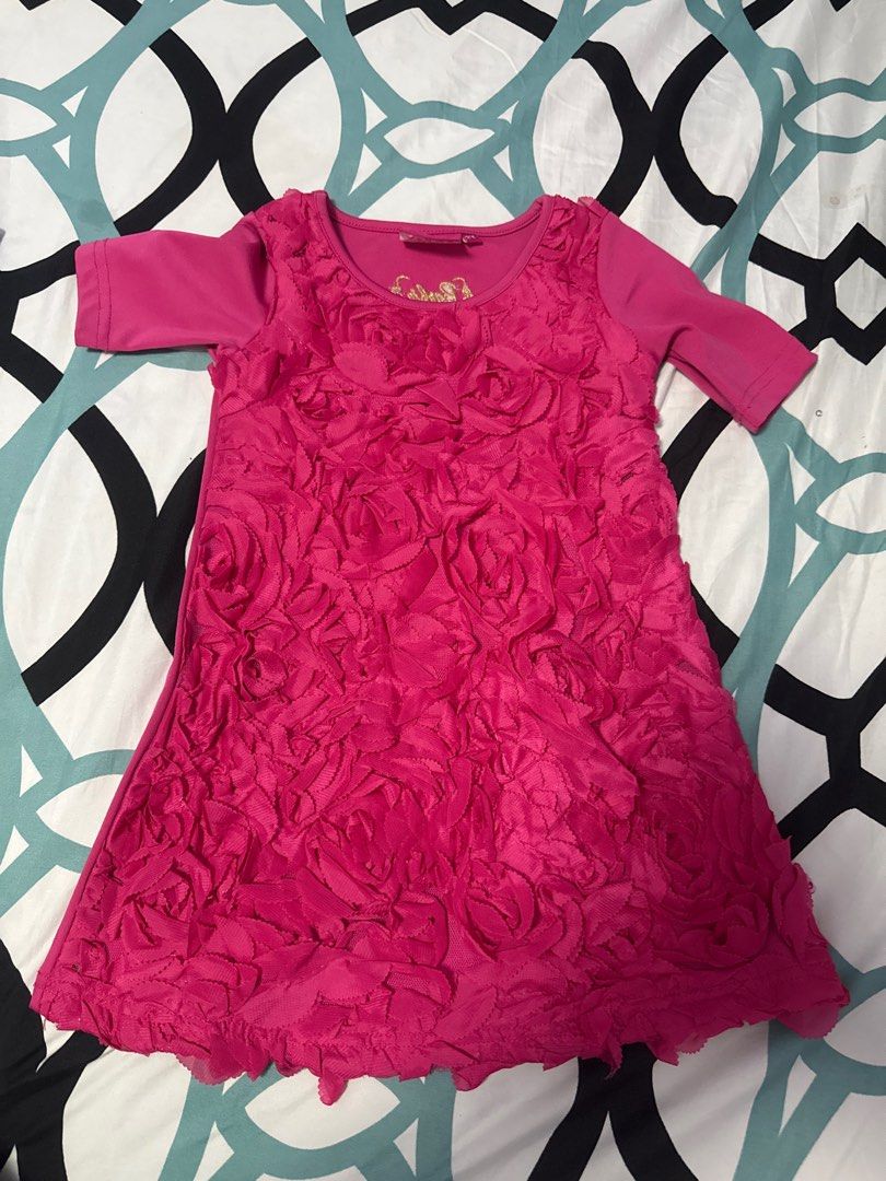 Barbie Pink Rose Dress (Category: Babies & Kids Fashion) located in Bacoor. Submitted by rizza_455 (Listing ID 1410092475, Image 1). Description: - Pink Barbie dress - Features a unique rose-like texture - Short sleeves - Round neckline - Made of soft material.