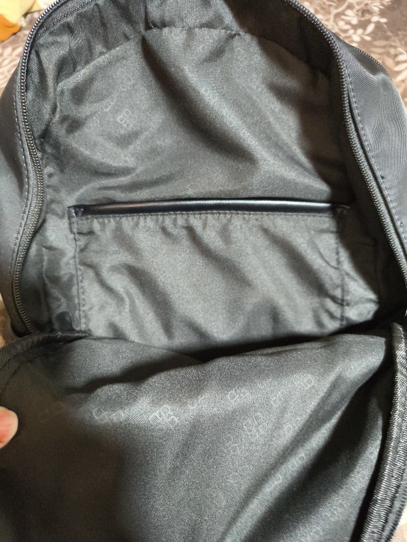 Black Backpack (Category: Backpacks) located in Singapore. Submitted by helloheyhi (Listing ID 1410135619, Image 3). Description: - Stylish black backpack - Adjustable straps - Front zippered pocket - Side pockets - Main zip has no tassel (check last picture for reference) - Perfect for everyday use .