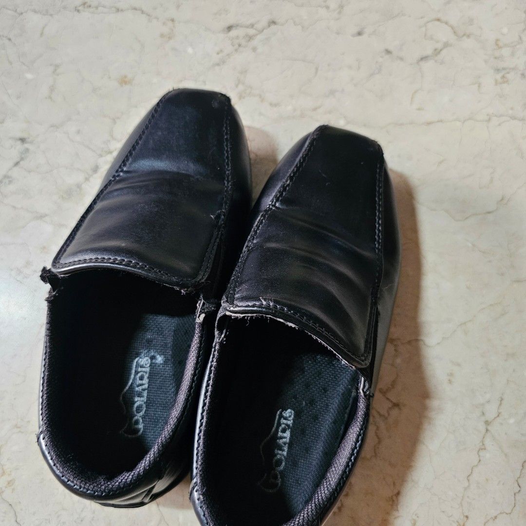 BLACK SCHOOL SHOES for kid (Category: Babies & Kids Fashion) located in Paranaque City. Submitted by mystuffmel (Listing ID 1410061007, Image 1). Description: - Black Polaris slip-on loafers - Sole dimensions: 8 inches (length) x 3 inches (width) - Shows wear and tear on the edges - Black interior with Polaris logo RFS decluttering.