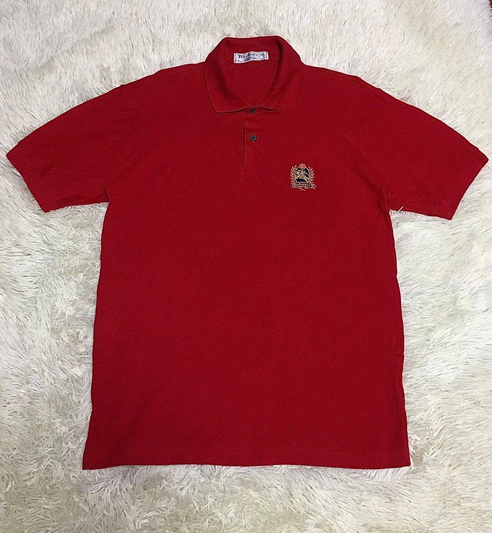 Burberrys Red Polo Shirt(VINTAGE) (Category: Tshirts & Polo Shirts ) located in Tuguegarao City. Submitted by kidbornok (Listing ID 1410143382, Image 1). Description: -Burberrys red polo shirt(Vintage) - Embroidered Burberrys logo -Size LARGE 21X28 - Collared neckline - Color rate 10/10 -No issue.