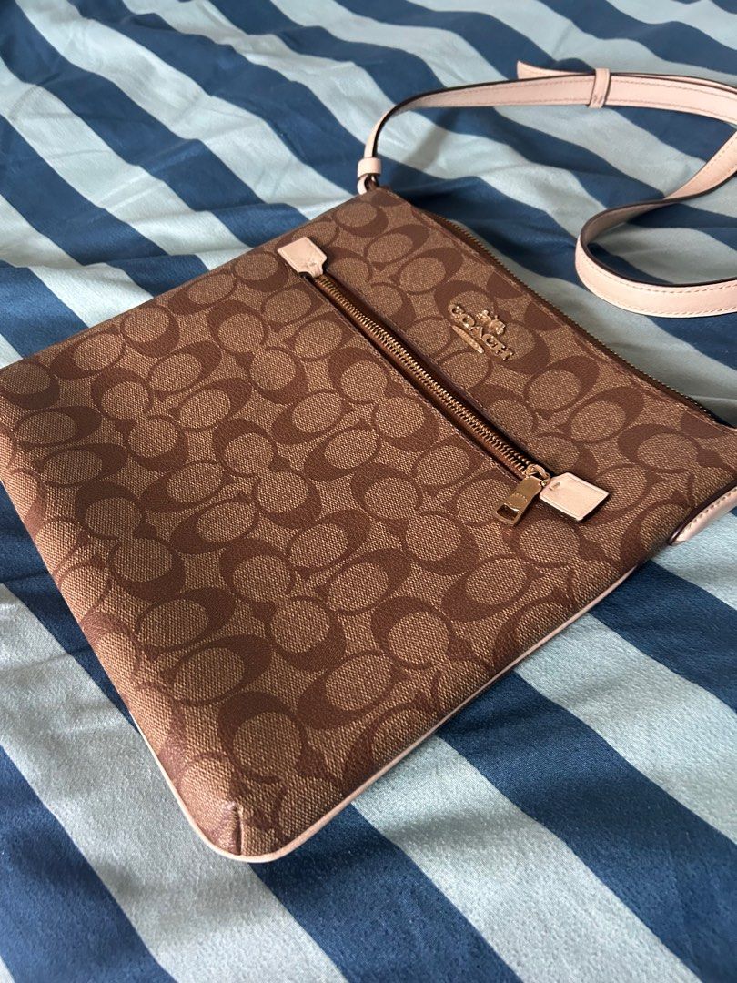 Coach Rowan File Bag (Category: Luxury Bags & Wallets) located in Mandaluyong City. Submitted by dessaint (Listing ID 1410035135, Image 2). Description: Handled with care. Bought from Vancouver. No scratches nor any problems..