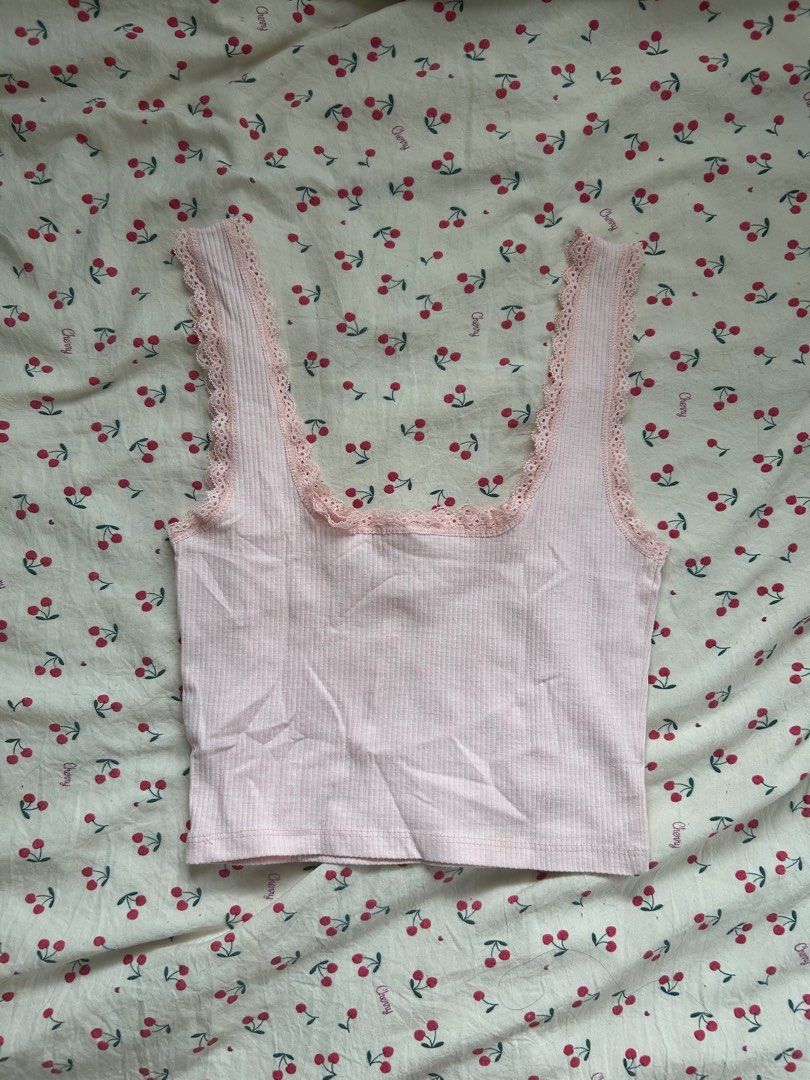Cotton On Pink Coquette Top (Category: Others Tops) located in Pasig City. Submitted by cheribombed (Listing ID 1410027474, Image 2). Description: 🌸 Cotton On Pink Coquette Lace Top 🌸 PHP 250 + SF 🍧 Bought from an IG store, never worn 🍧 Last price 🍧 With rosette detailing 🍧 Smocked back 🍧 Very coquette, good for layering! 🍧 RFS: not my style, I don’t really reach for it :(( 🍧 SF to be shouldered by buyer; can do J&T, LBC, and Lalamove wi