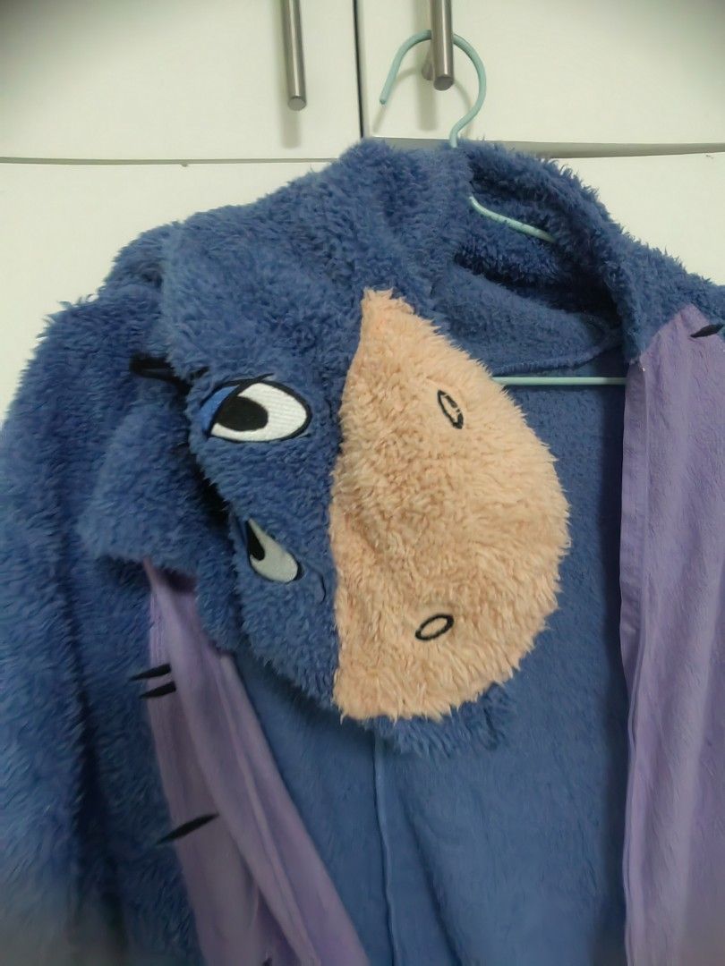 Disney Eeyore Onesie Costume (Category: Undergarments & Loungewear) located in Manila. Submitted by dhyig (Listing ID 1410059691, Image 3). Description: - Disney Eeyore onesie costume - Size: XL-Large - Design: Blue and purple with Eeyore's face on the hood - Material: Soft, plush - Features: Zipper closure for easy wear.