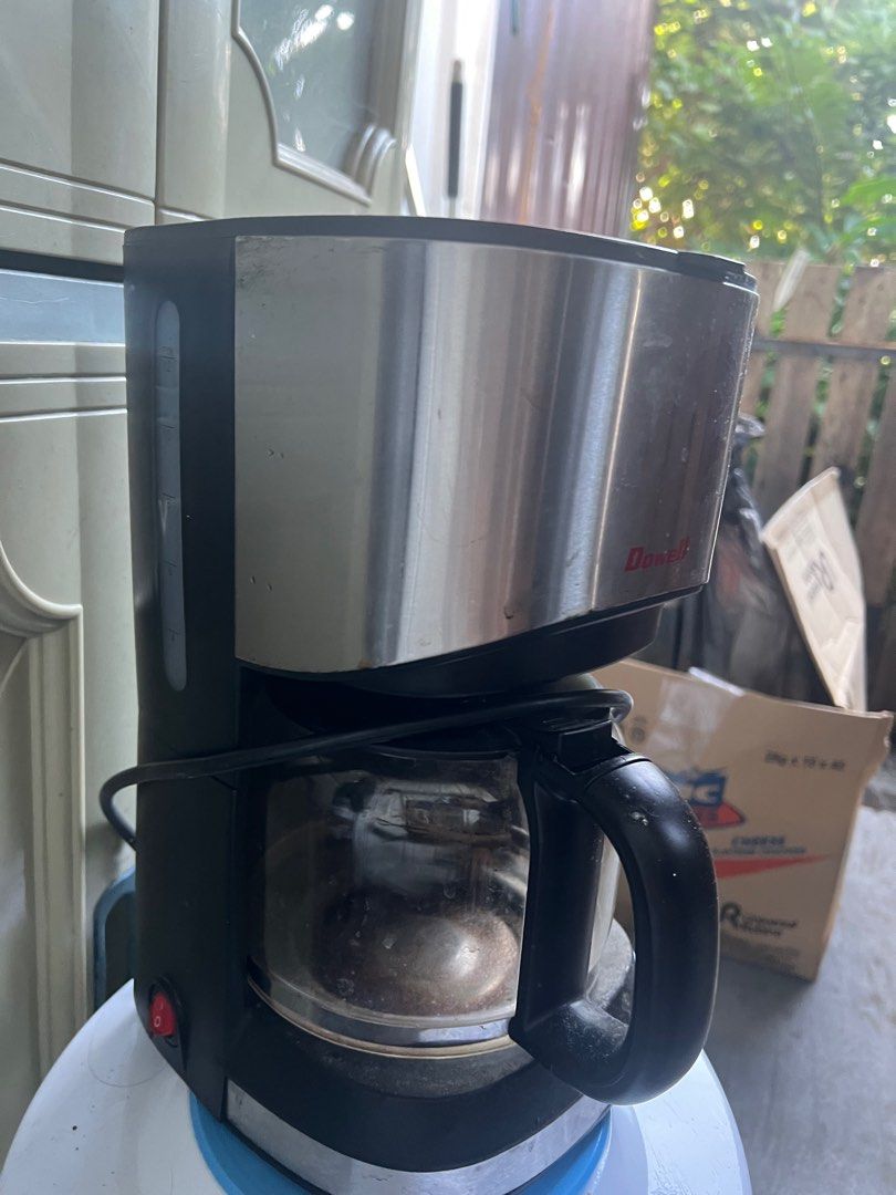 Dowell Coffee Maker (Category: Coffee Machines & Makers) located in San Mateo. Submitted by junked (Listing ID 1409997261, Image 2). Description: Dowell coffee maker with a glass carafe. It has a black handle and a stainless steel body. The power button is red. The coffee maker is designed to brew coffee. It has a water level indicator on the side. The brand name "Dowell" is visible on the front..