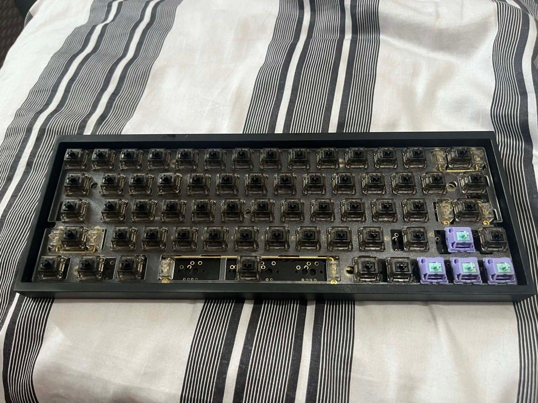 Dz60 Tofu60 aluminum case keyboard (Category: Computer Keyboard) located in Taytay. Submitted by shendoremi (Listing ID 1410025767, Image 2). Description: with RGB (soldered) Frosted Polycarbonate plate Modded stabs 61key layout Gateron Black ink V1 (lubed and filmed) keycaps included Issue: right shift and left arrow key not working. I'm not sure if it need resoldering or change switches.