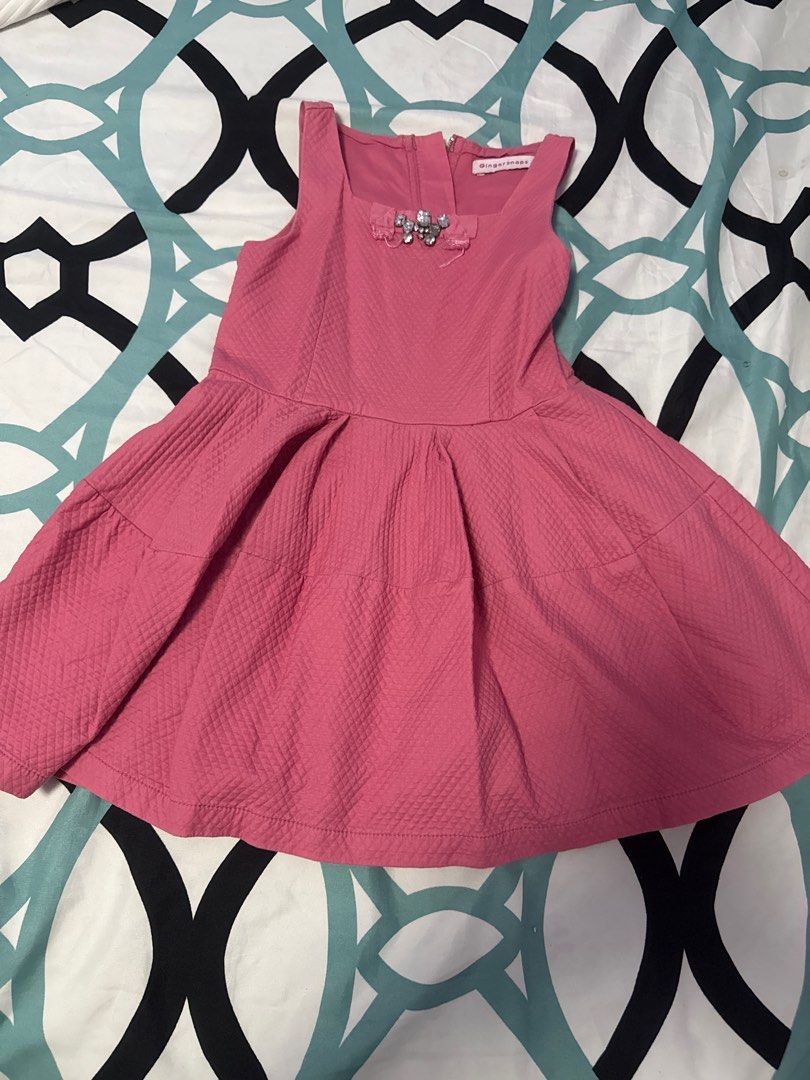 Ginger Snaps Pink Dress (Category: Babies & Kids Fashion) located in Bacoor. Submitted by rizza_455 (Listing ID 1410089988, Image 1). Description: - Brand: Ginger Snaps - Color: Pink - Features: Square neckline, pleated skirt, decorative chest detail - Fabric: Textured, quilted - Closure: Back zipper - Perfect for: Special occasions or everyday wear Fit to 3-5 yrs old.
