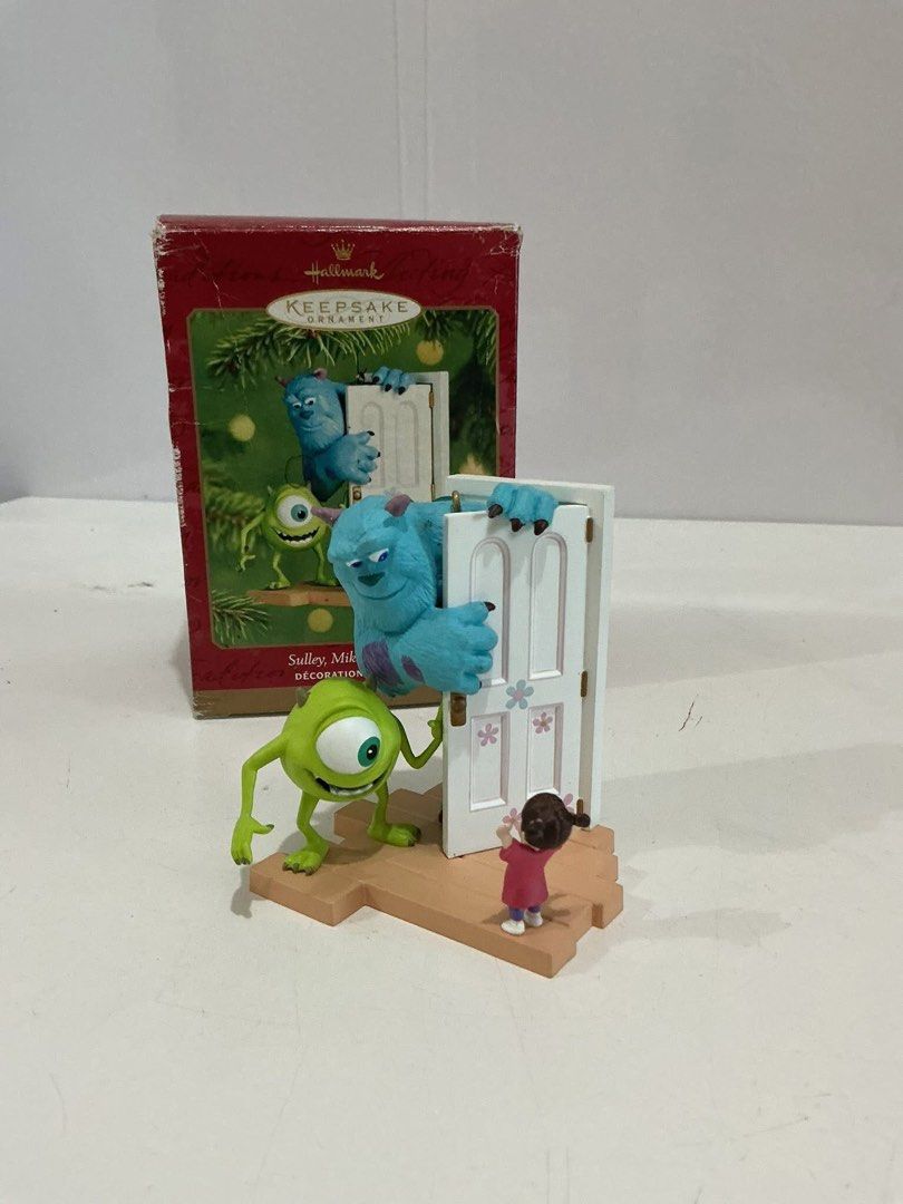 Hallmark Monsters, Inc. Ornament (Category: Character Goods) located in Mandaluyong City. Submitted by hearthearty (Listing ID 1409998429, Image 1). Description: - Hallmark Keepsake ornament - Features Sulley, Mike, and Boo from Monsters, Inc. - Depicts characters with a door - Includes original box - Decorative item - Ideal for Monsters, Inc. fans.