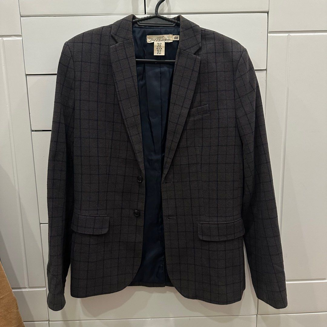 H&M L.O.G.G. Checkered Blazer (Category: Coats, Jackets and Outerwear) located in Manila. Submitted by waldorf024 (Listing ID 1410081823, Image 1). Description: Stylish H&M blazer in a checkered pattern. Features a classic two-button closure and a notched lapel. The blazer has a dark navy blue lining. The size is US 20, CA 14A+, and UK 14Y+. Perfect for adding a touch of sophistication to any outfit..