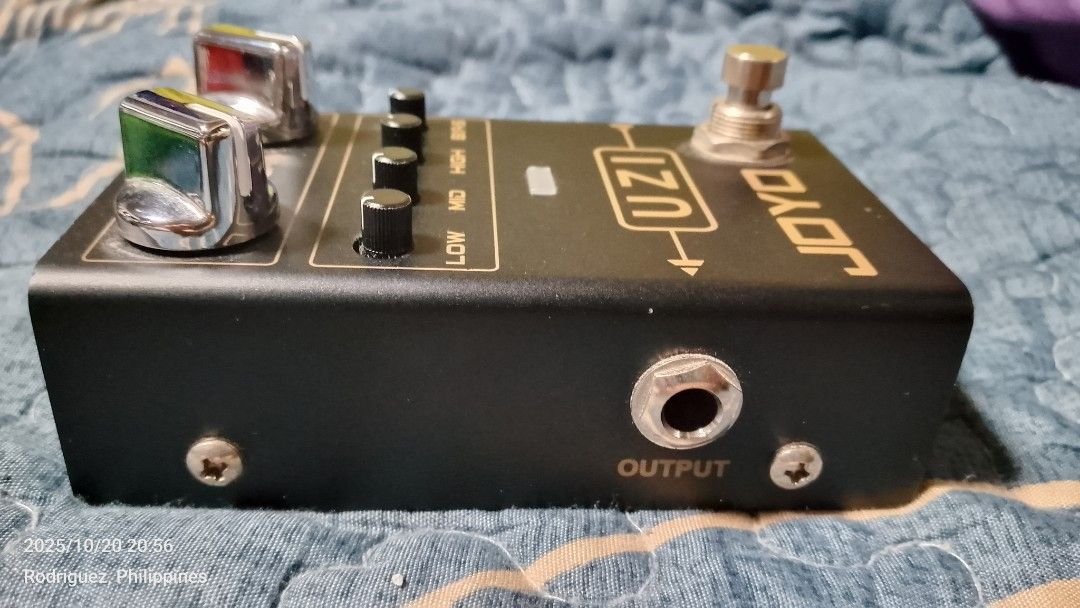 JOYO UZI Distortion Guitar Pedal (Category: Musical Instruments) located in Quezon City. Submitted by vastwhale_d30e56 (Listing ID 1410010702, Image 2). Description: JOYO UZI distortion guitar pedal. Features gain, volume, and tone controls (Low, Mid, High, Bias). Includes input and output jacks, and a DC 9V power input. The pedal has a footswitch for activation and a sync switch on the back. Made in China..