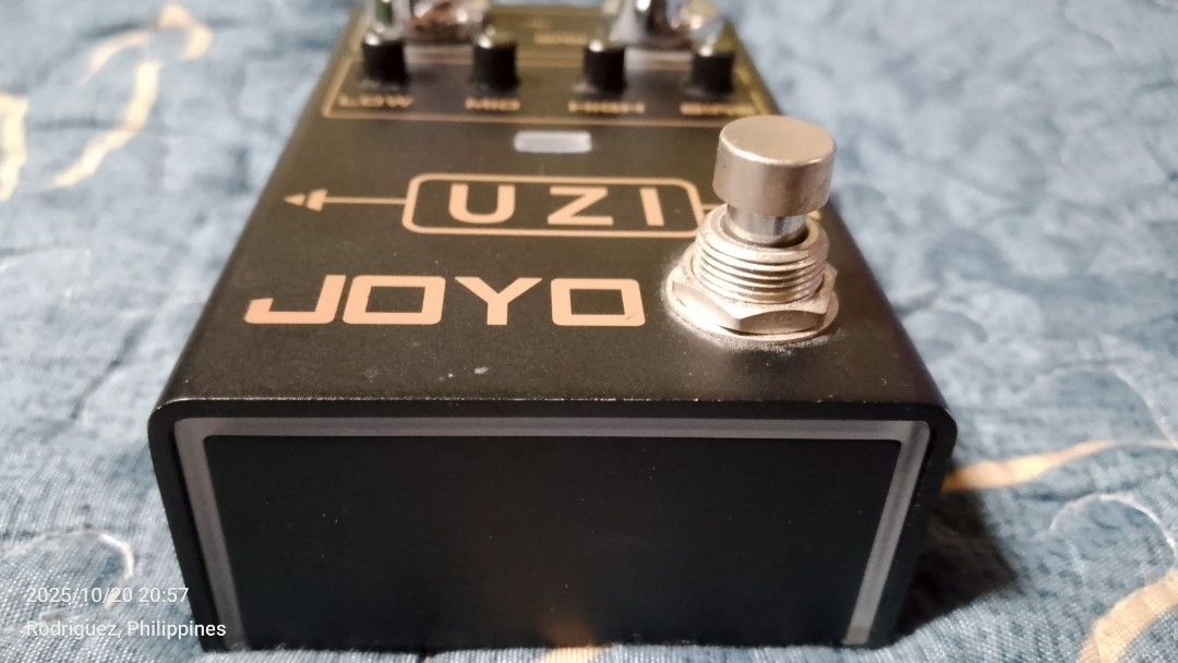JOYO UZI Distortion Guitar Pedal (Category: Musical Instruments) located in Quezon City. Submitted by vastwhale_d30e56 (Listing ID 1410010702, Image 3). Description: JOYO UZI distortion guitar pedal. Features gain, volume, and tone controls (Low, Mid, High, Bias). Includes input and output jacks, and a DC 9V power input. The pedal has a footswitch for activation and a sync switch on the back. Made in China..