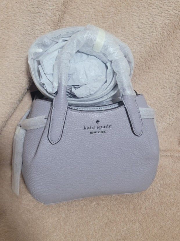 Kate Spade Mini Dumpling (Category: Luxury Bags & Wallets) located in San Pablo. Submitted by brandedandmore (Listing ID 1410169176, Image 1). Description: Brandnew Original Kate Spade Dumpling in Gray. Us bought. No other inclusions just polyolastic and tag..