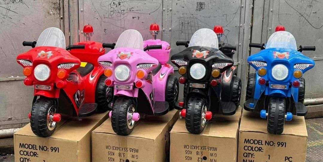 Kids Electric Motorcycle (Category: Kids Toys) located in Caloocan City. Submitted by gemmareas571129 (Listing ID 1410078381, Image 1). Description: - Electric ride-on motorcycle for kids - Available colors: Red, Pink, Black, Blue - Features: Siren light head light - Suitable for young children - Model: 991 - Shown on original box.