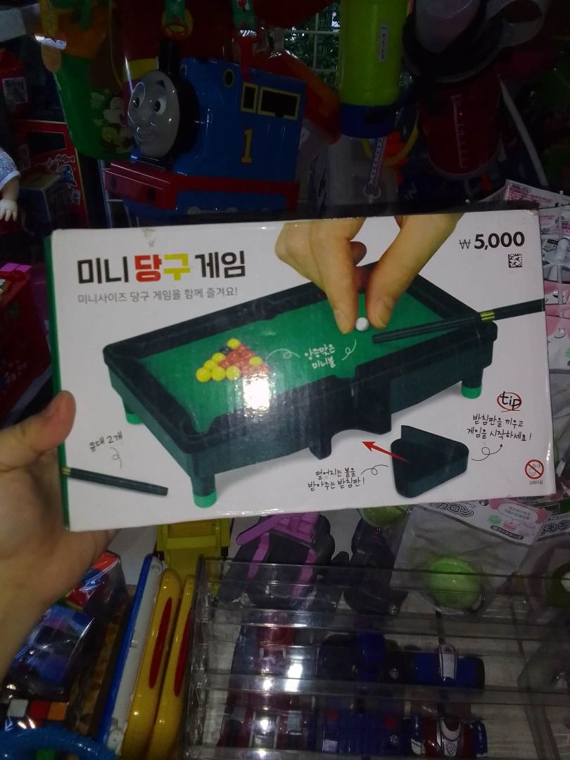 Miniature Billiard Game (Category: Board Games & Puzzles) located in Tanza. Submitted by leonskidskorner (Listing ID 1410125181, Image 1). Description: - Miniature billiard table included - Comes with two cues and billiard balls - Box features game play illustration and a playing tip .
