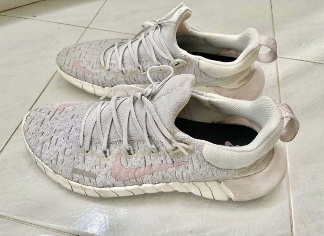Nike Free 5.0 Sneakers (Category: Sneakers) located in Quezon City. Submitted by k.rgnz (Listing ID 1410118747, Image 3). Description: - Nike Free 5.0 sneakers size 6.5 - Light grey and pink colorway - Breathable knit upper - Lace-up closure - Flexible sole - Nike swoosh logo on side - barely used - will clean before shipping.