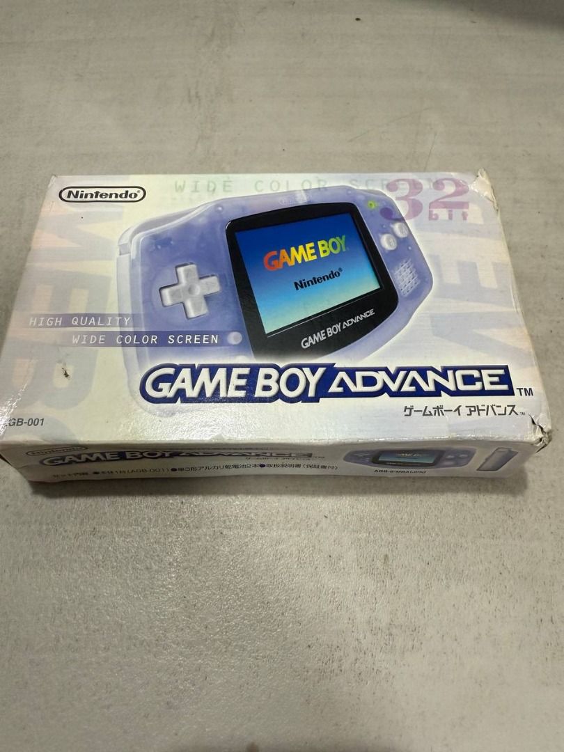 Nintendo Game Boy Advance CIB with box (Category: Nintendo) located in Manila. Submitted by pael92 (Listing ID 1410175524, Image 3). Description: - Nintendo Game Boy Advance console for sale. - Translucent gray color. - Includes original box and manuals. - Box art features a purple Game Boy Advance. - Standard button layout. - Console is in good working condition..