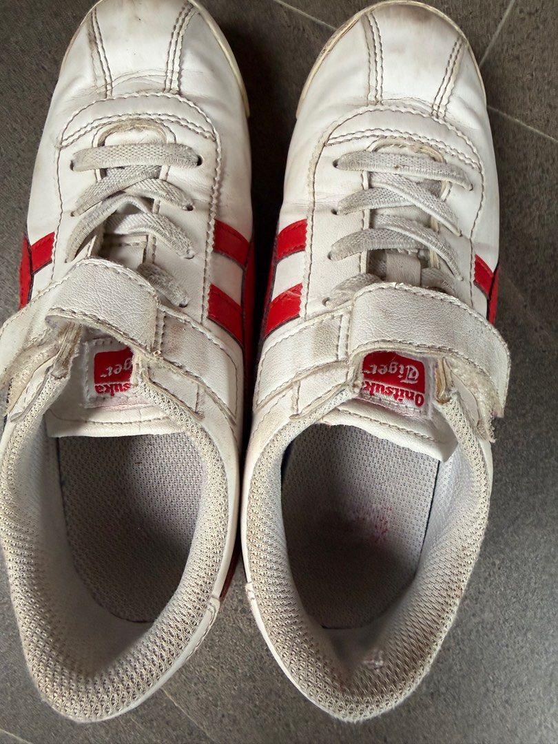 Onitsuka Tiger Kids Sneakers (Category: Babies & Kids Fashion) located in Bacolod City. Submitted by re-kindle (Listing ID 1410023067, Image 3). Description: - Onitsuka Tiger sneakers - White with red stripes - Velcro strap and laces - Blue sole - Size: US 1, EUR 32.5, 20 cm - Material: Synthetic leather upper, rubber sole - Made in Vietnam.