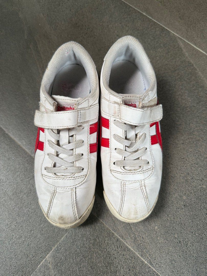 Onitsuka Tiger Kids Sneakers (Category: Babies & Kids Fashion) located in Bacolod City. Submitted by re-kindle (Listing ID 1410023067, Image 1). Description: - Onitsuka Tiger sneakers - White with red stripes - Velcro strap and laces - Blue sole - Size: US 1, EUR 32.5, 20 cm - Material: Synthetic leather upper, rubber sole - Made in Vietnam.