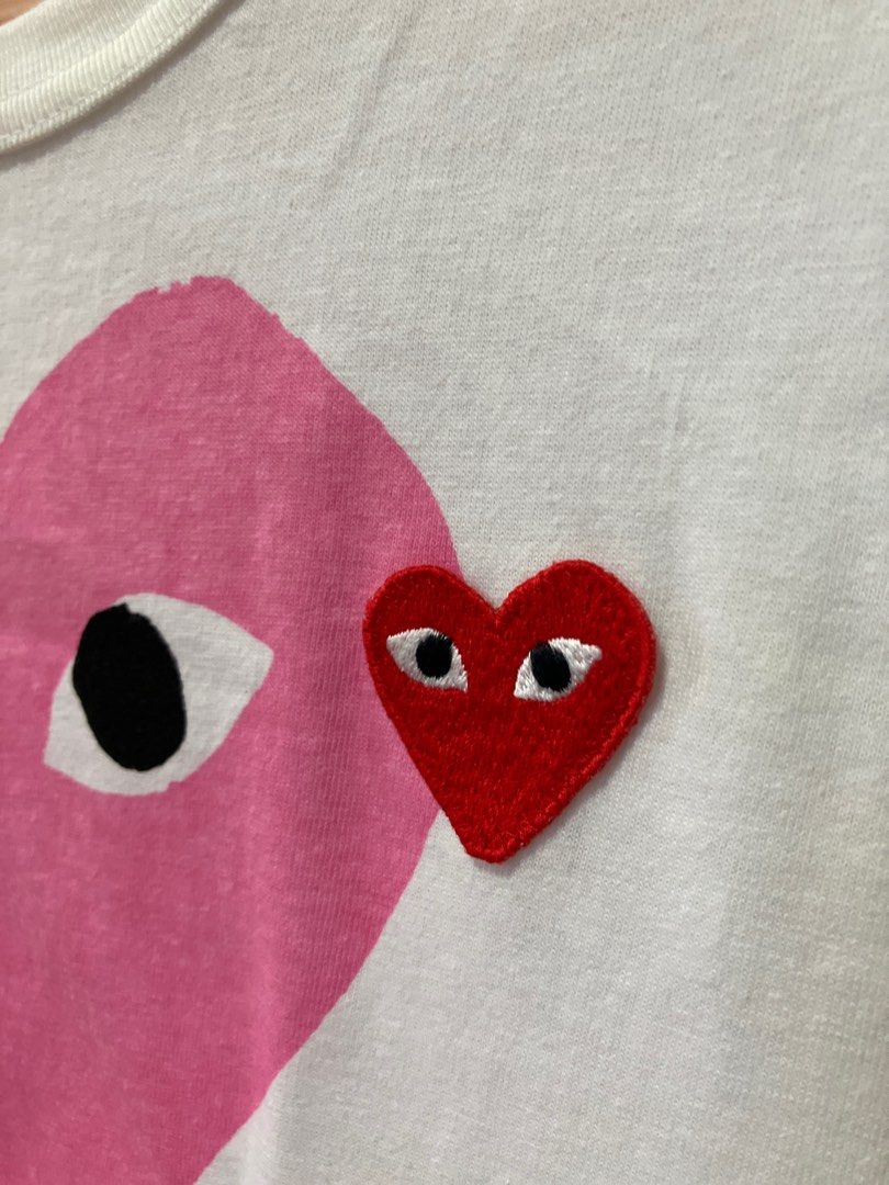 ORIG Comme des Garcons Play Heart T-shirt (Category: Shirts) located in Binan City. Submitted by mrsjca (Listing ID 1410042252, Image 3). Description: Original, bought in the US Worn only twice, then stored. Some yellowing due to storage but can be removed with proper washing. Cute pink heart, with red heart patch..