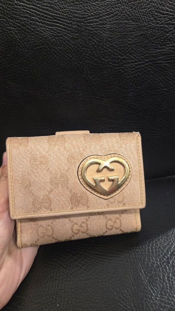 Orig, Gucci GG Canvas Wallet (Category: Luxury Bags & Wallets) located in Quezon City. Submitted by mbpreloved65 (Listing ID 1410096394, Image 1). Description: - Authentic Gucci wallet - GG canvas exterior - Multiple card slots - Clear ID window - Coin compartment - Snap closure - Gold-tone accent - Leather interior - Serial number: "212733-2873".