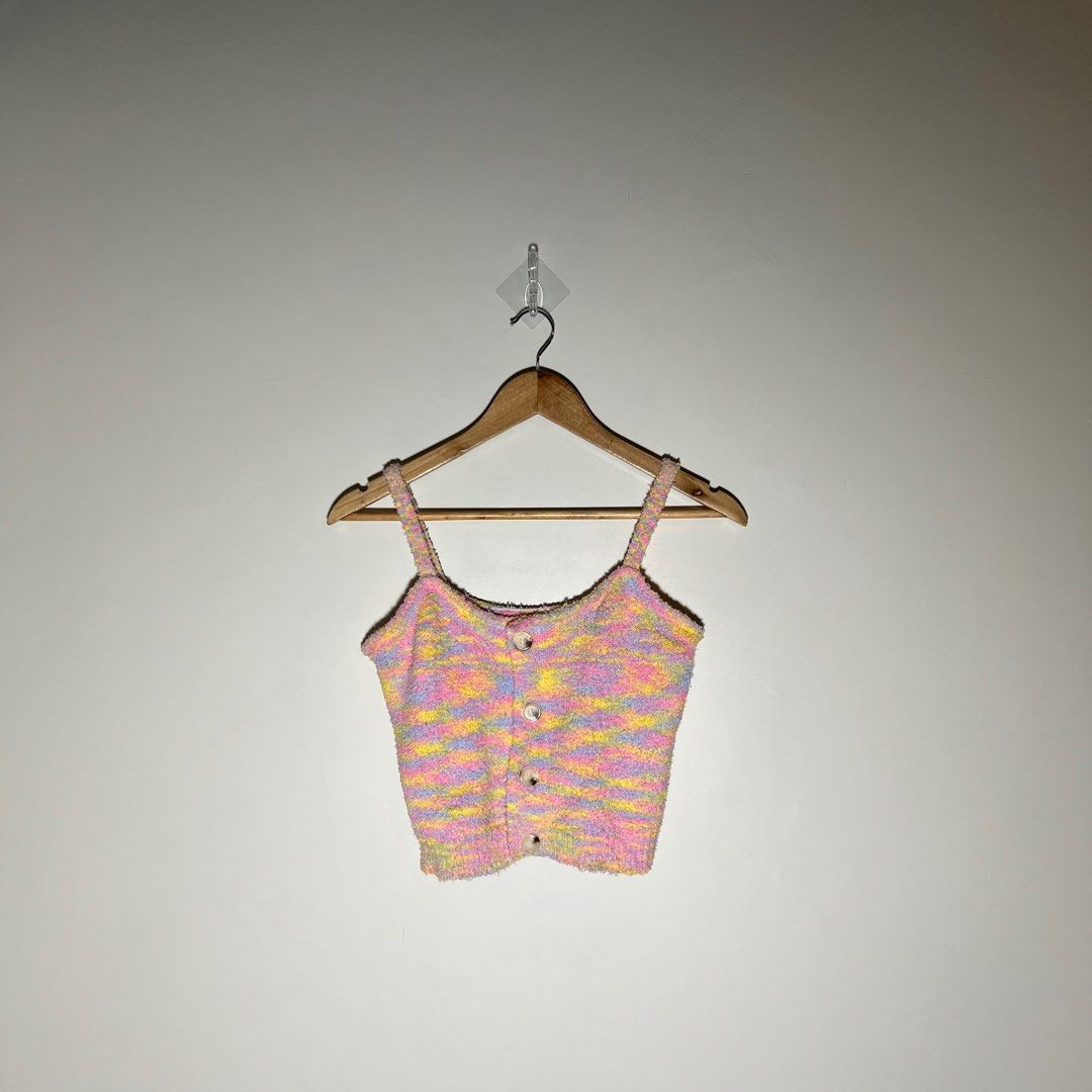 Pastel Rainbow Fuzzy Knit Button Crop Top (Category: Sleeveless) located in Paranaque City. Submitted by shopdeclutterfly (Listing ID 1410174873, Image 1). Description: BRAND: None BEST FITS: S-M Message me for more information. Important Notes: — Color may vary slightly due to lighting and screen settings. — This is a preloved item. — Minor signs of wear may be present — There may be small stains, dots, or marks due to storage and previous use. 
