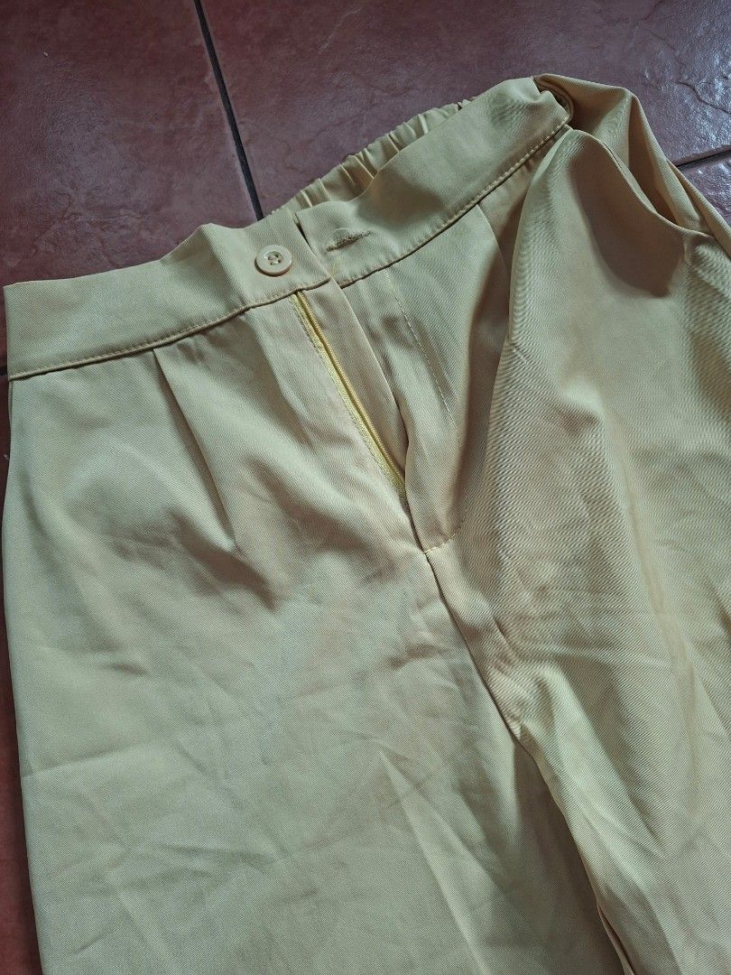 pastel yellow wide leg pants (Category: Other Bottoms) located in Muntinlupa City. Submitted by starcrossed (Listing ID 1410081384, Image 2). Description: - Wide-leg pants - Light green color - Button closure - Classic, simple design - Lightweight fabric - Comfortable for everyday wear.
