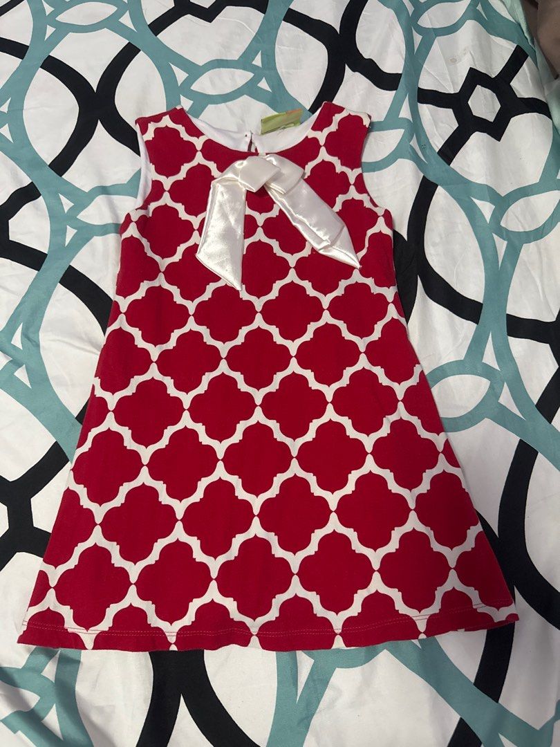 Penelope Red and White Dress (Category: Babies & Kids Fashion) located in Bacoor. Submitted by rizza_455 (Listing ID 1410091751, Image 1). Description: - Penelope dress in red and white. - Features a quatrefoil pattern. - Includes a white bow detail. - Sleeveless design. - Ideal for warm weather and young girls. 2 yrs old.
