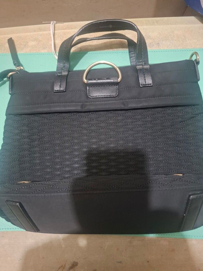 Radley London Black Handbag (Category: Luxury Bags & Wallets) located in Manila. Submitted by shopendlessly7611 (Listing ID 1410164630, Image 2). Description: - Black Radley London handbag - Textured front panel - Leather handles - Detachable shoulder strap ( with strap - Multiple interior compartments - Patterned lining - Includes original tags - Handle shows some wear - no strap but you may buy strap.