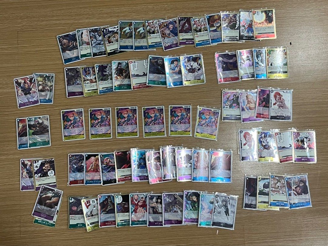 Rare 74pcs - One Piece Japanese Bulk (Category: Raw Singles) located in Taguig. Submitted by kghobbies (Listing ID 1410152513, Image 1). Description: All Cards are Sleeved All Rare Cards 74pcs Take all only.
