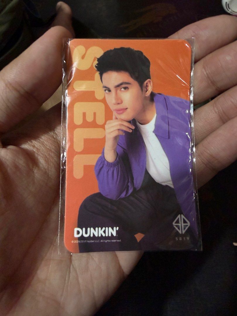 SB19 Dunkin' Gift Card (Category: Other Merchandise) located in Caloocan City. Submitted by Jaesoon2022 (Listing ID 1410179325, Image 2). Description: - Collectible Dunkin' gift card - Features SB19's Stell - Orange card, sealed - Includes SB19 and Dunkin' logos - Perfect for SB19 fans and collectors.