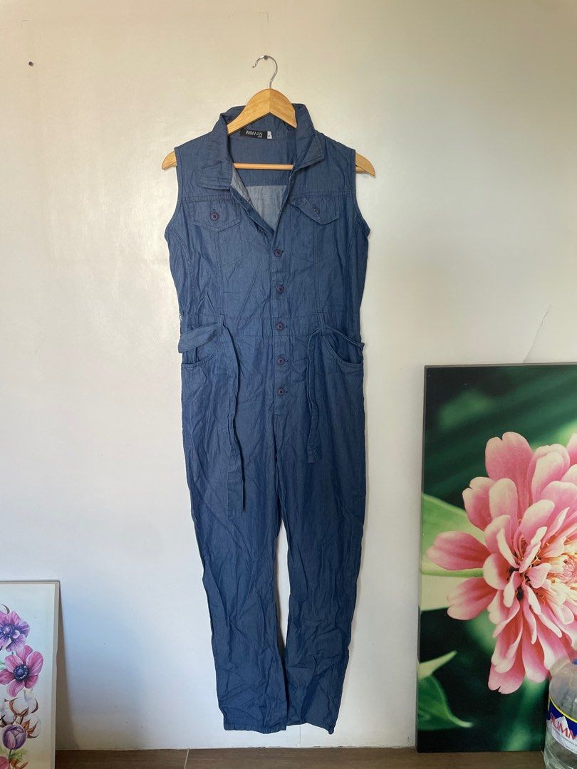 SM Woman Jeans Sleeveless Jumpsuit - Medium (Category: Jumpsuits) located in Cavite. Submitted by _nicoffee (Listing ID 1410085196, Image 2). Description: - SM Woman Jeans jumpsuit - Sleeveless design - Denim material - Blue color - Medium size - Collared neckline - Button-down front - Includes belt.