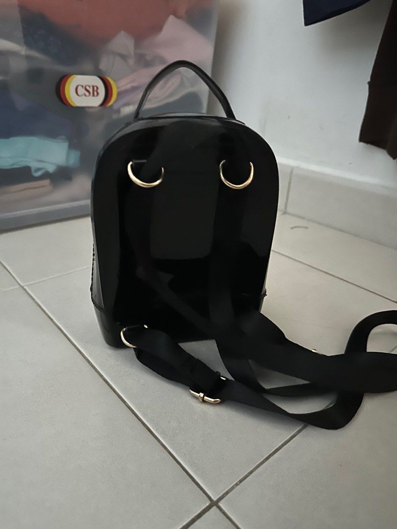 small black backpack (Category: Backpacks) located in Singapore. Submitted by NanaKo (Listing ID 1410102514, Image 2). Description: -bought overseas -adjustable straps -really small, cute, petite backpack that can fit wallet,phone, etc -used only a couple of times -meetups only.