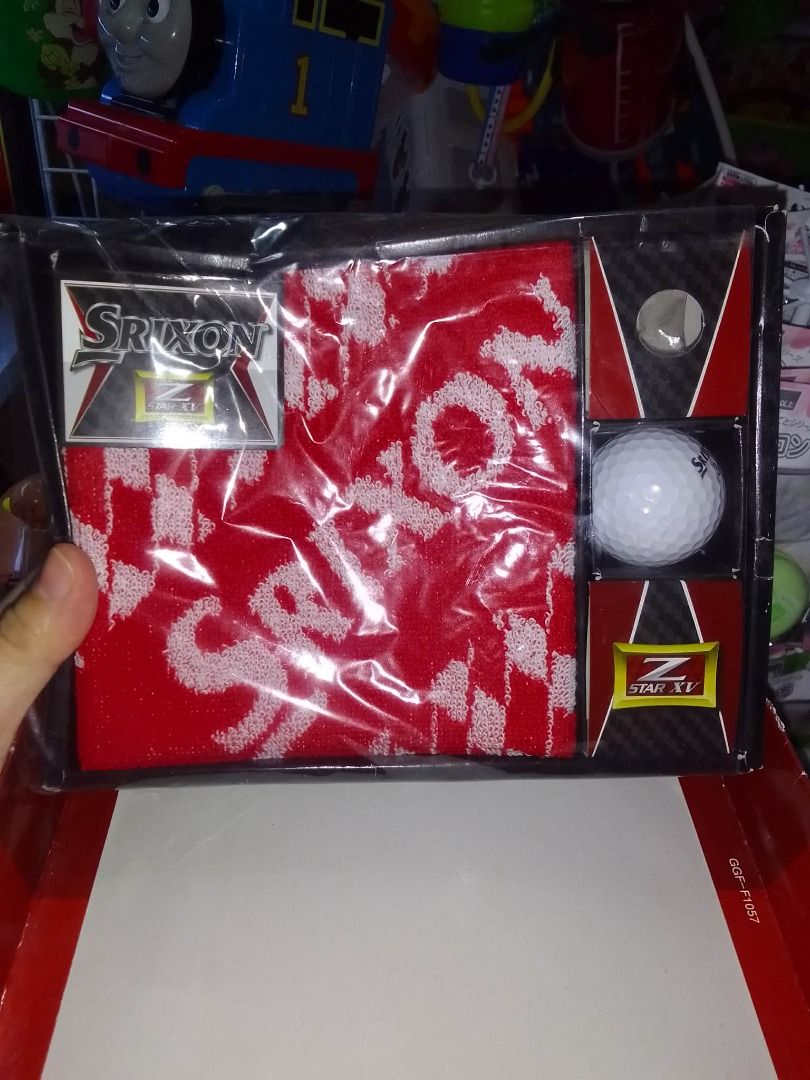 Srixon Z-Star XV Golf Set (Category: Golf) located in Tanza. Submitted by leonskidskorner (Listing ID 1410124747, Image 1). Description: - Srixon golf set - Includes: - Red and white towel with Srixon logo - Z-Star XV golf ball - Tee marker - Packaged in a box.