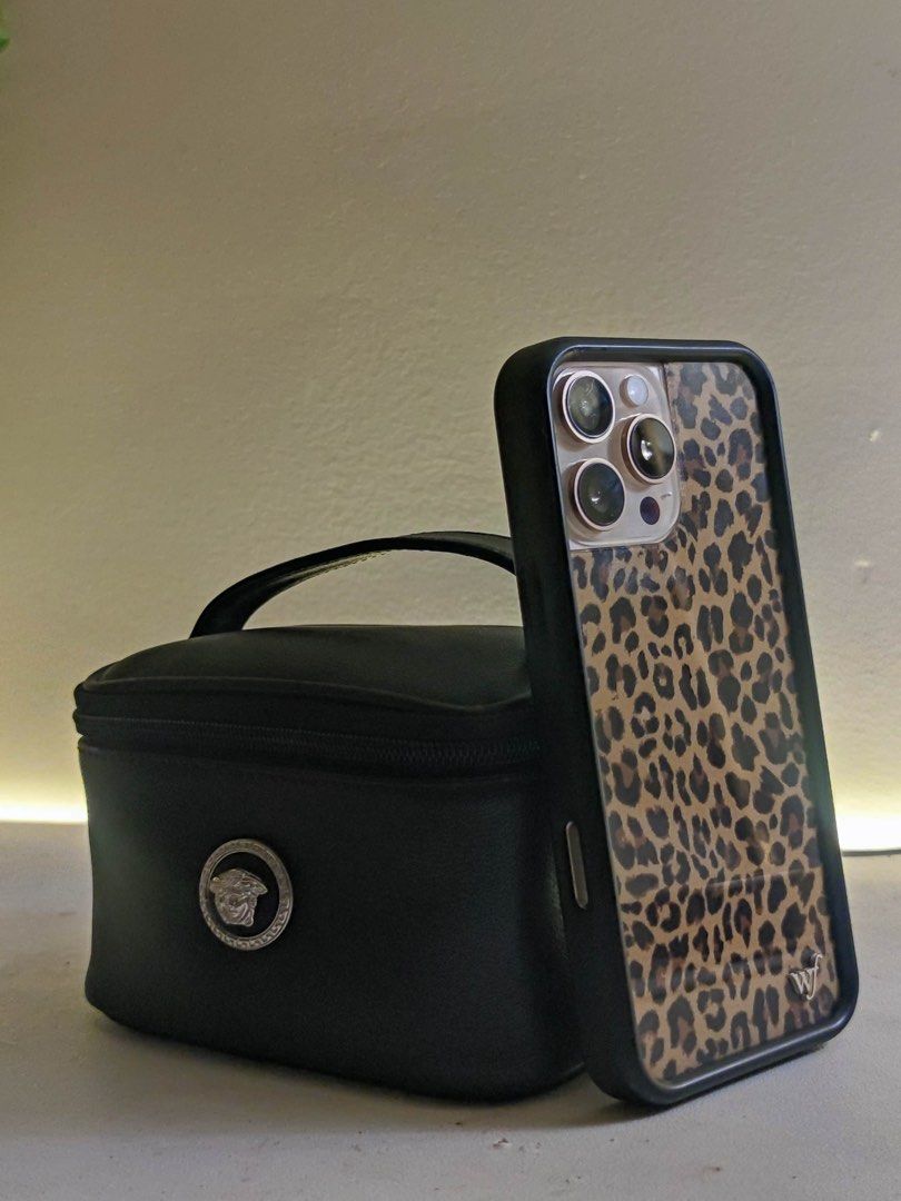 Versace Mini Vintage Cosmetic Bag (Category: Luxury Bags & Wallets) located in Mandaluyong City. Submitted by mybellashop (Listing ID 1410151111, Image 3). Description: • Brand: Versace • Item: Vintage Leather Cosmetic Bag • Color: Black • Condition: Like new ‼️Size comparison to IP16PM‼️ 📍 Mandaluyong City (MOP): GCash / BDO or COD (MOD): J&T, Lalamove, etc..