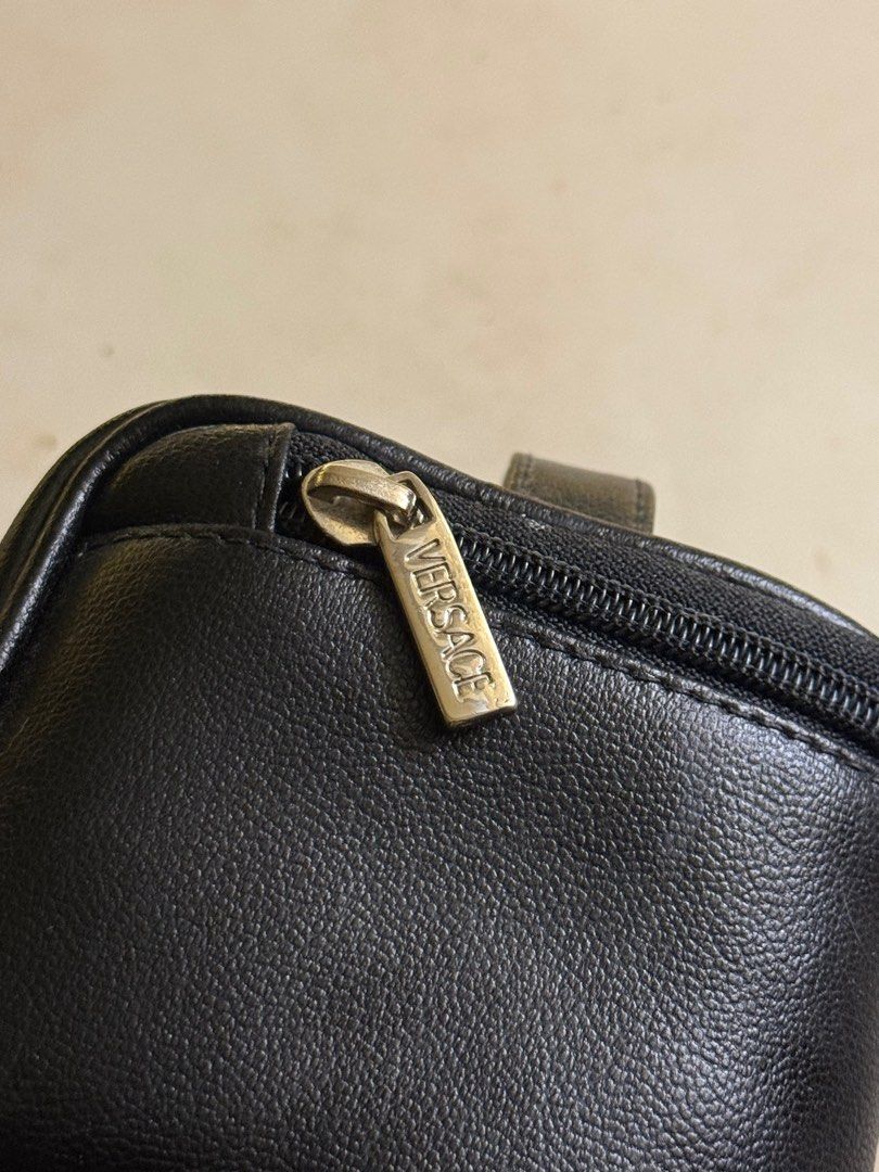 Versace Mini Vintage Cosmetic Bag (Category: Luxury Bags & Wallets) located in Mandaluyong City. Submitted by mybellashop (Listing ID 1410151111, Image 2). Description: • Brand: Versace • Item: Vintage Leather Cosmetic Bag • Color: Black • Condition: Like new ‼️Size comparison to IP16PM‼️ 📍 Mandaluyong City (MOP): GCash / BDO or COD (MOD): J&T, Lalamove, etc..