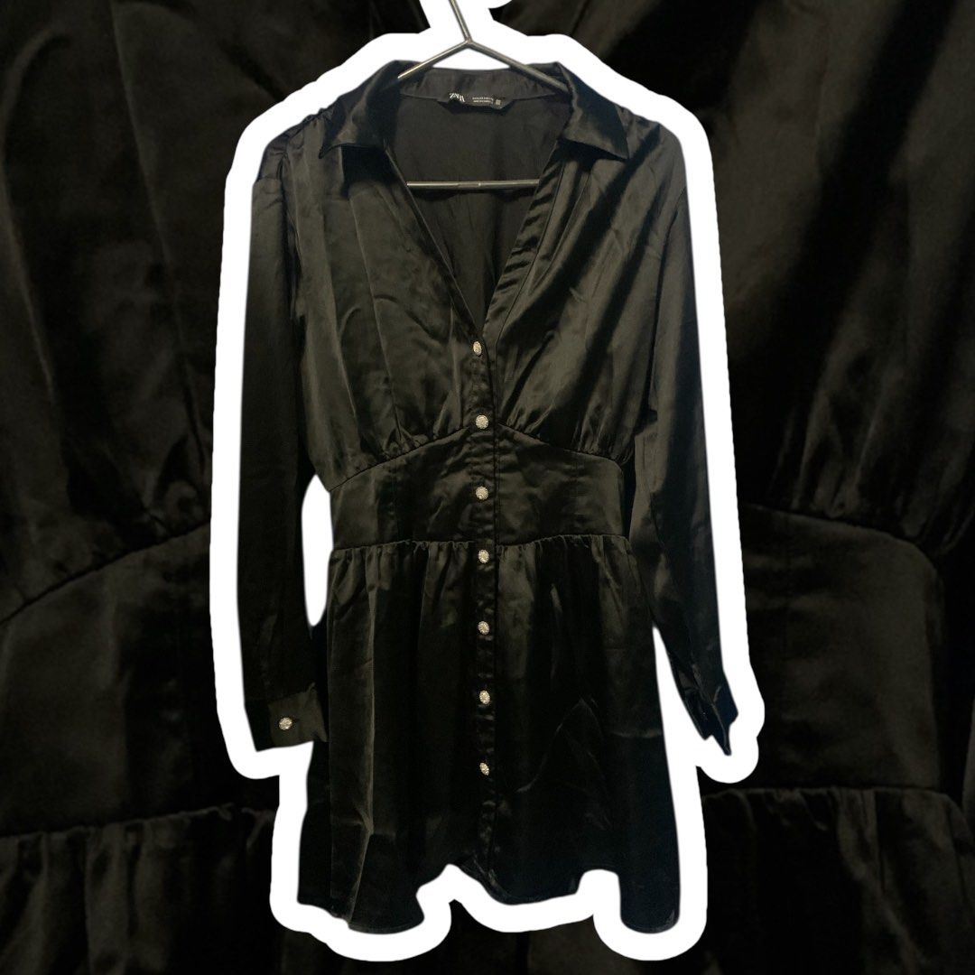 Zara Black Satin Dress (Category: Dresses) located in Malabon City. Submitted by vewonica (Listing ID 1410092291, Image 1). Description: - Zara black satin dress - Collared neckline - Button-down front - Long sleeves with decorative cuff buttons - Fitted waist - Flared skirt - Shirred waist detail at the back - Perfect for a night out or special event.