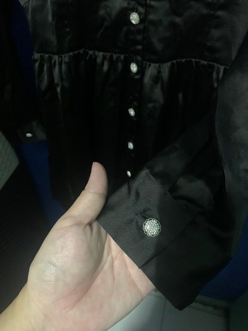 Zara Black Satin Dress (Category: Dresses) located in Malabon City. Submitted by vewonica (Listing ID 1410092291, Image 3). Description: - Zara black satin dress - Collared neckline - Button-down front - Long sleeves with decorative cuff buttons - Fitted waist - Flared skirt - Shirred waist detail at the back - Perfect for a night out or special event.